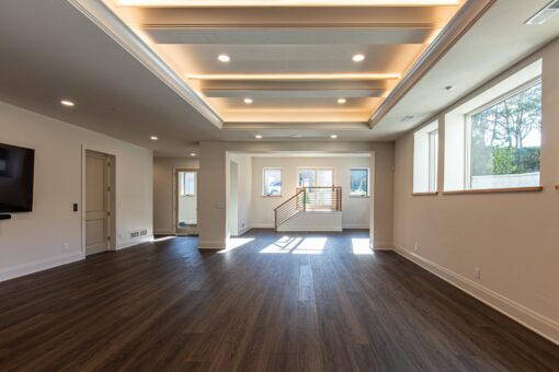 Carlisle lower-level family room with lit tray ceiling