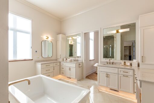 Carlisle primary bath double vanities and freestanding tub