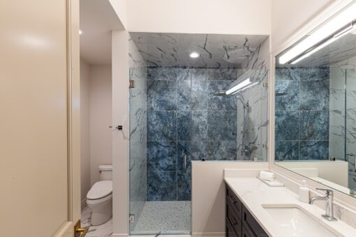 Carlisle blue marble shower with glass enclosure