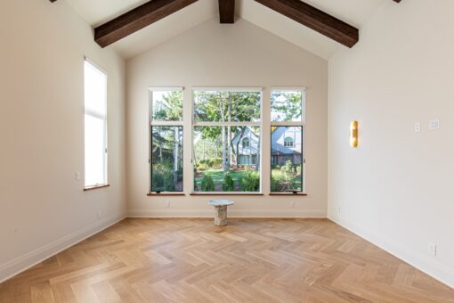 Carlisle bedroom with timber beam and window wall