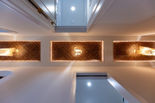 Carlisle ceiling with woven wood panels and lighting