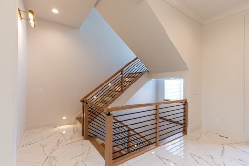 Carlisle staircase with wood railing and horizontal bars