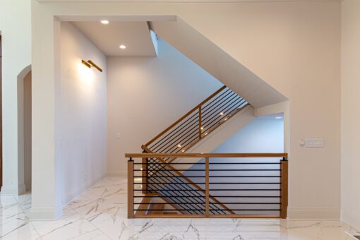 Carlisle open staircase with wood treads and metal railing