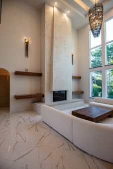 Carlisle great room with fireplace and window wall