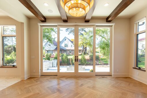 Carlisle hearth room with French doors and timber beams
