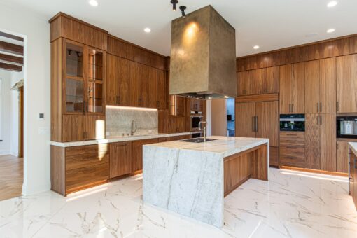 Carlisle kitchen with marble waterfall island and walnut cabinetry
