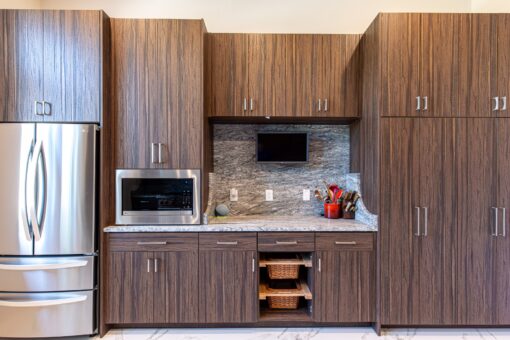 Carlisle kitchen with walnut cabinetry and built-in appliances