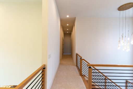 Carlisle upper hallway with wood railing