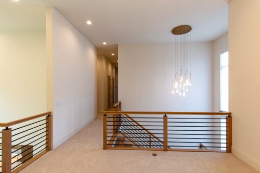 Carlisle loft hallway with wood and metal railing