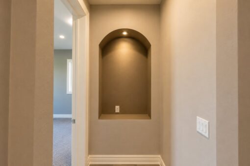 Auburn custom home in Brookfield by Kingfogl – 1st floor - hallway - arched niche