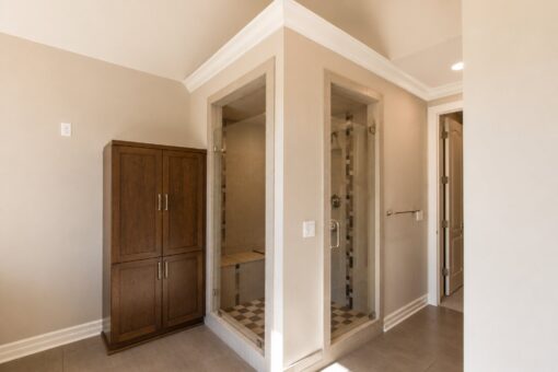 Auburn custom home in Brookfield by Kingfogl – 1st floor - primary bath - showers
