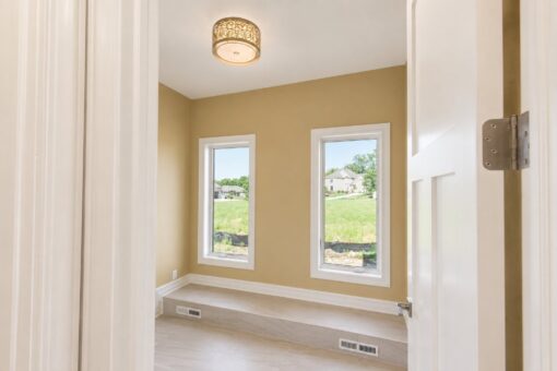 Auburn custom home in Brookfield by Kingfogl – 1st floor - tiled room with windows