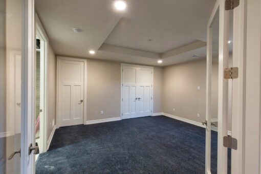 Auburn custom home in Brookfield by Kingfogl – basement - bedroom - view 1