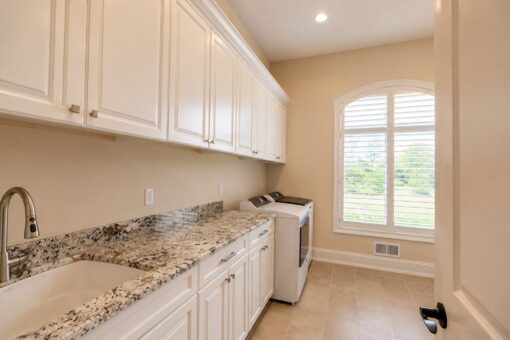 Bella Casa custom home in Mequon by Kingfogl – laundry room