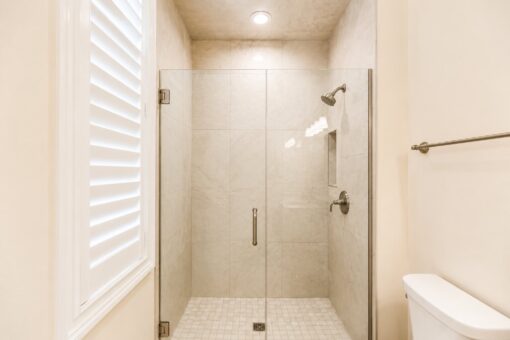 Bella Casa custom home in Mequon by Kingfogl – guest bath 1 shower