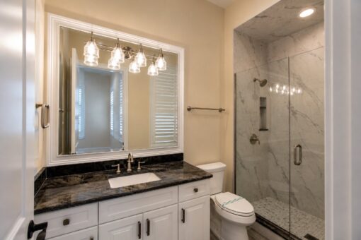 Bella Casa custom home in Mequon by Kingfogl – guest bath 2 vanity