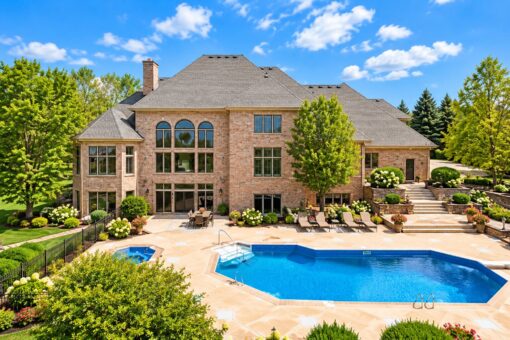 Danbury custom home in Brookfield by Kingfogl – rear elevation with pool and paver patio