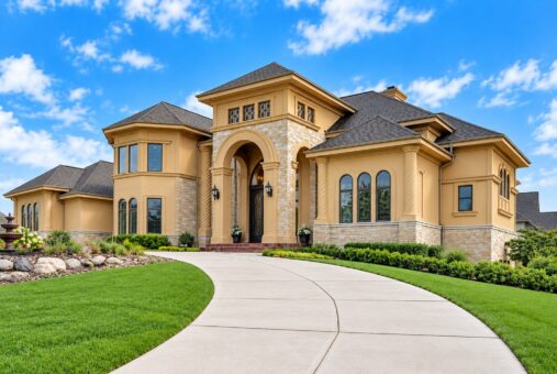 Edington custom home in Brookfield by Kingfogl – front elevation with curved driveway