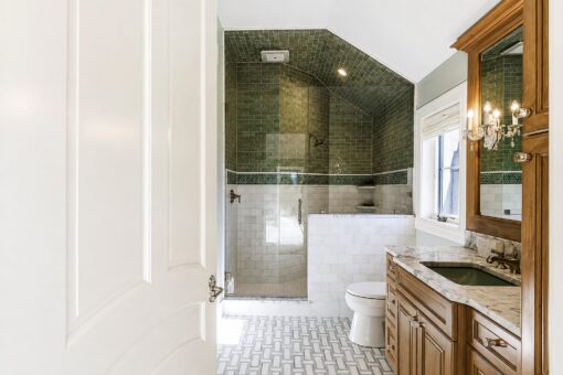Gatsby custom home in Oconomowoc by Kingfogl – 1st floor - green tile bath