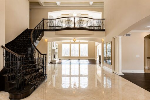 Prescott custom home in Mequon by Kingfogl – foyer curved staircase