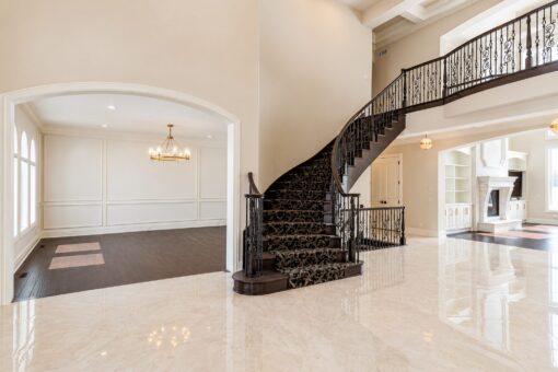 Prescott custom home in Mequon by Kingfogl – foyer staircase view