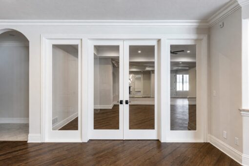 Prescott custom home in Mequon by Kingfogl – lower level exercise room glass doors
