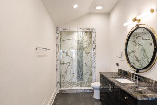 Prescott custom home in Mequon by Kingfogl – bath dark marble