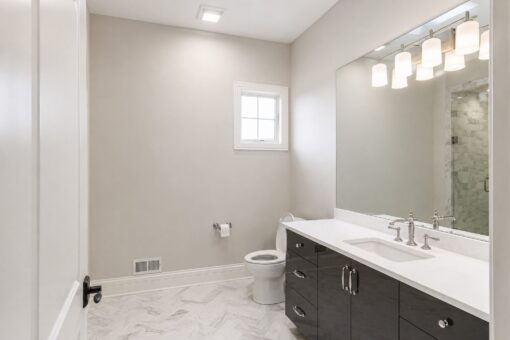 Prescott custom home in Mequon by Kingfogl – bath marble tile vanity