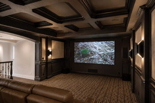 Prescott custom home in Mequon by Kingfogl – lower level theater screen view 2