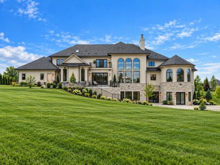 Prescott custom home in Mequon by Kingfogl – rear elevation with expansive lawn