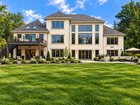 Rangeline custom home in Mequon by Kingfogl – rear elevation with deck and large windows