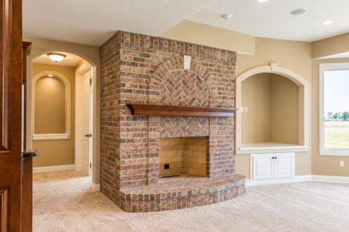 Richland custom home in Brookfield by Kingfogl – basement - fireplace - view 1
