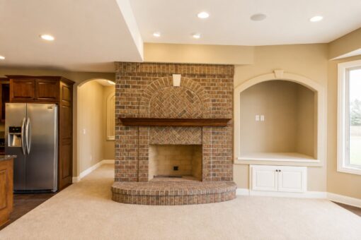 Richland custom home in Brookfield by Kingfogl – basement - fireplace - view 2