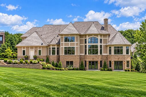 Richland custom home in Brookfield by Kingfogl – rear elevation with brick exterior and large windows
