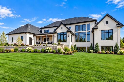 Ridge custom home in Colgate by Kingfogl – rear elevation with walls of glass and covered patio