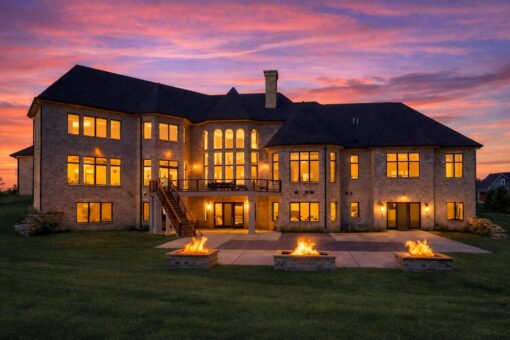 Saddlebrook custom home in Mequon by Kingfogl – exterior rear elevation sunset