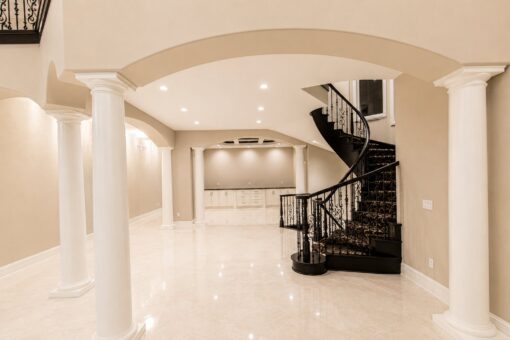 Saddlebrook custom home in Mequon by Kingfogl – dining room and spiral staircase