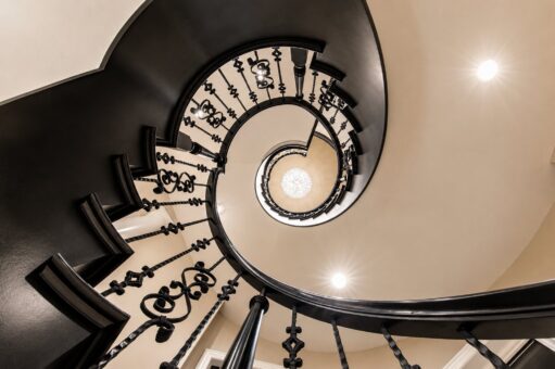 Saddlebrook custom home in Mequon by Kingfogl – spiral staircase looking up