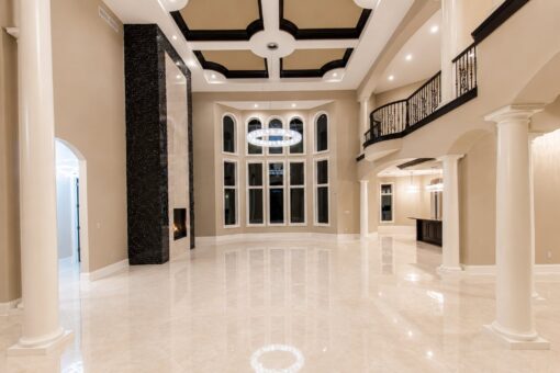 Saddlebrook custom home in Mequon by Kingfogl – great room fireplace and windows view 1