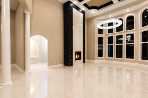 Saddlebrook custom home in Mequon by Kingfogl – great room fireplace and windows night