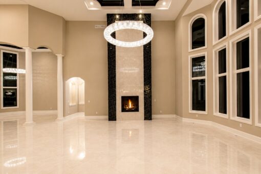Saddlebrook custom home in Mequon by Kingfogl – great room fireplace night