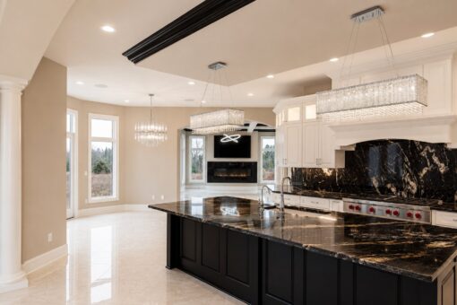 Saddlebrook custom home in Mequon by Kingfogl – kitchen island and family room