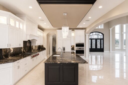 Saddlebrook custom home in Mequon by Kingfogl – kitchen island toward foyer