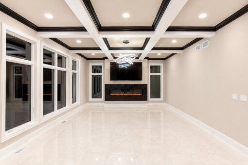 Saddlebrook custom home in Mequon by Kingfogl – family room fireplace night