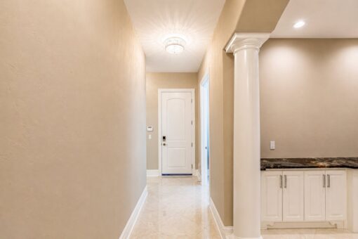 Saddlebrook custom home in Mequon by Kingfogl – rear hallway and entry door