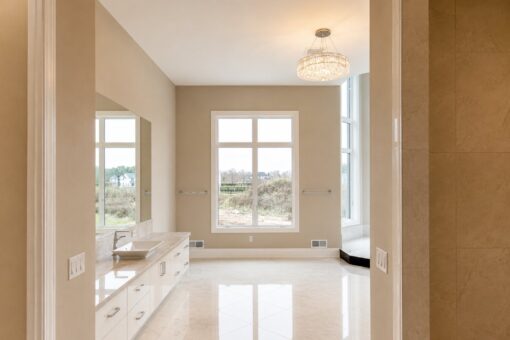 Saddlebrook custom home in Mequon by Kingfogl – primary bathroom vanity