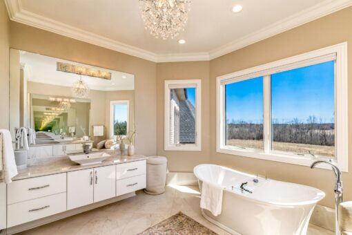 Saddlebrook custom home in Mequon by Kingfogl – 2nd floor bathroom 1 vanity and tub