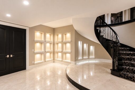 Saddlebrook custom home in Mequon by Kingfogl – basement staircase and display niches view 1