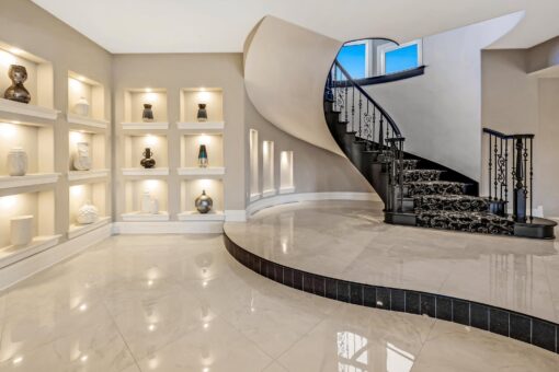 Saddlebrook custom home in Mequon by Kingfogl – basement staircase and display niches view 2
