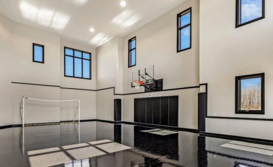 Saddlebrook custom home in Mequon by Kingfogl – basement basketball court view 2